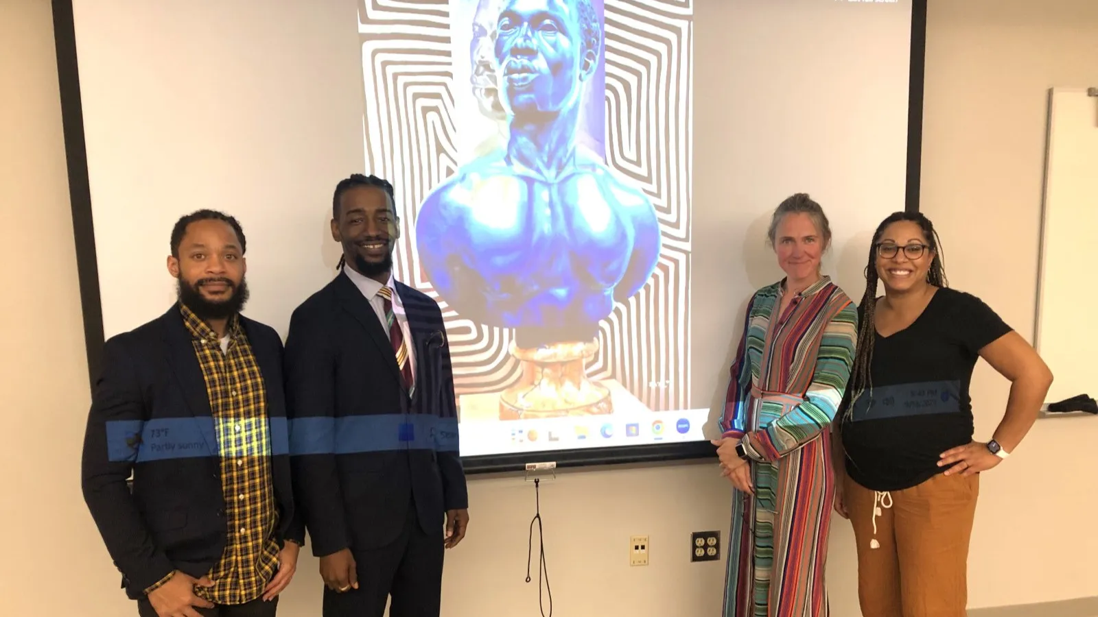 Terron Banner (left), Arris' J. Cohen, Merijn van der Heijden and Monica Stigler are pictured in front of a slide of Cohen's work.