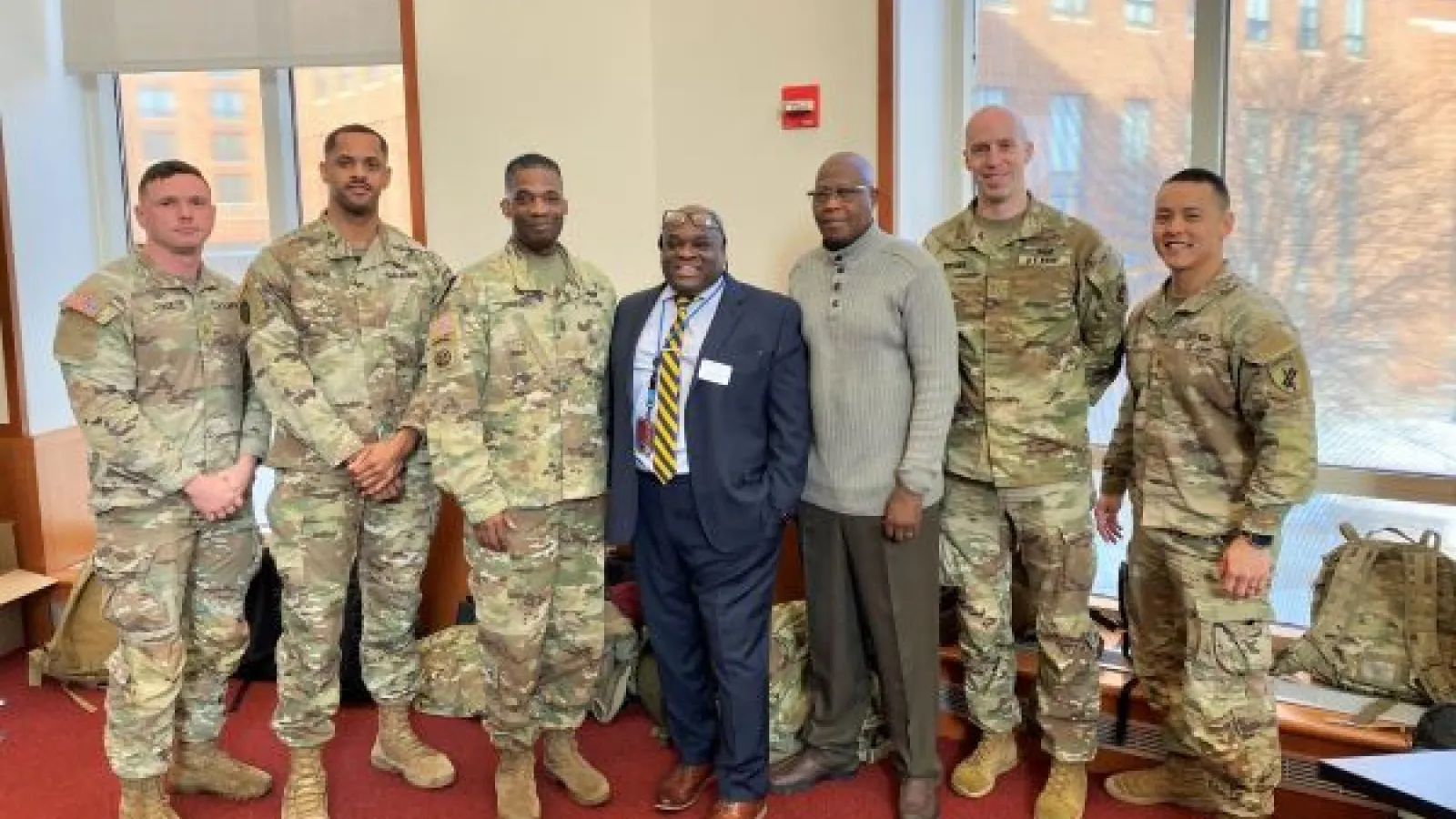U.S. Army Reserve members with CAS Assistant Director Jacien Carr and Director Ousman Murzik Kobo.