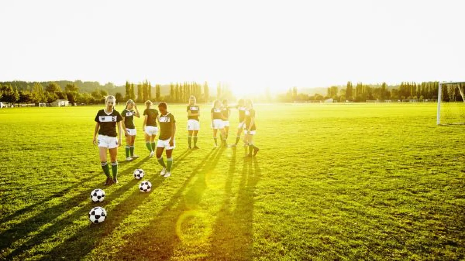 girls playing outdoor soccer