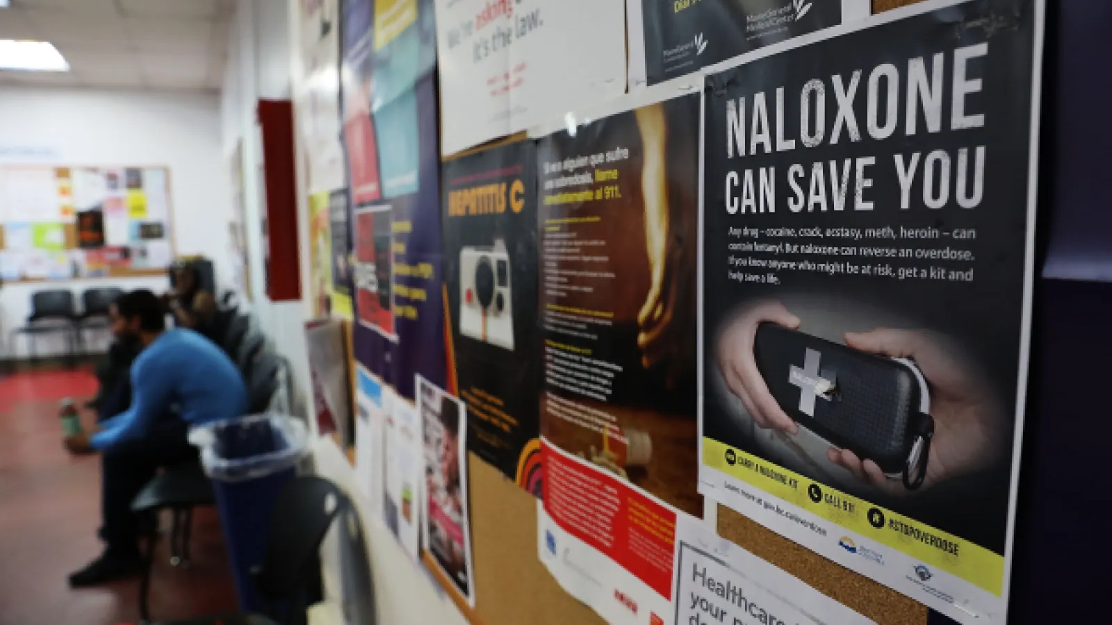 a naloxone poster on a pinboard