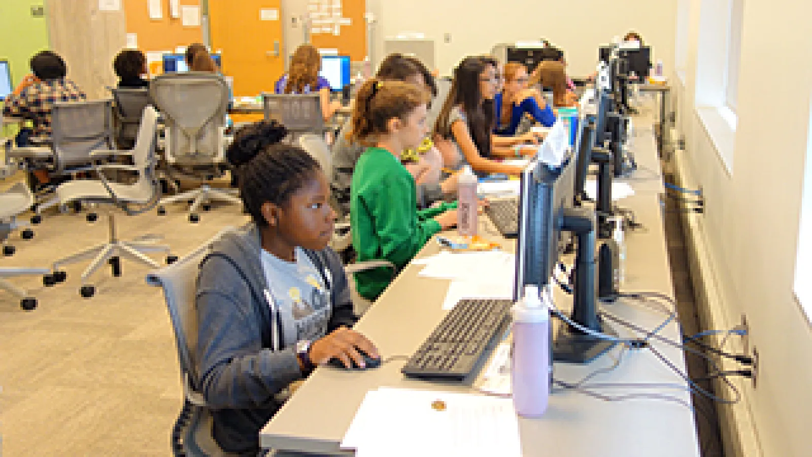 Students at computers learning how to animate