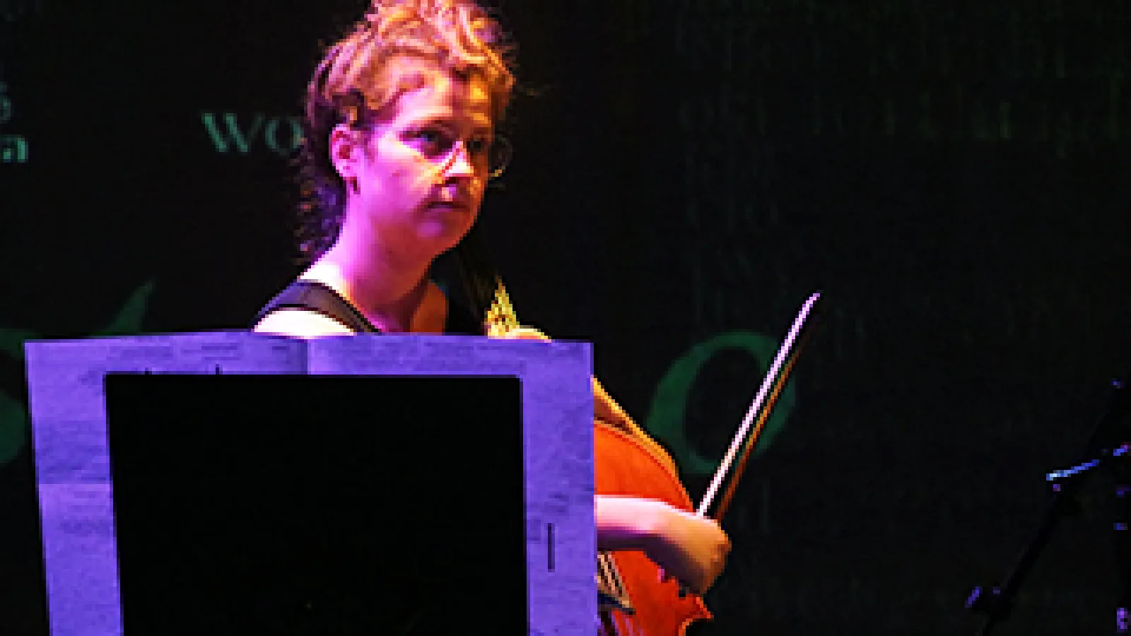 Caitlyn Trevor plays the cello in the ACCAD Motion Lab.