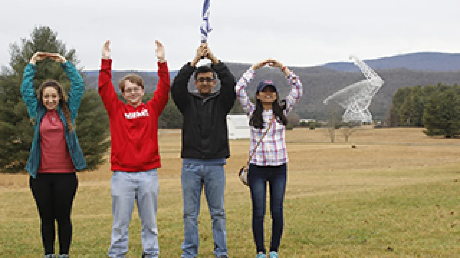 Students pose in O-H-I-O on the site of the Green Bank Telescope in Green Bank, West Virginia.