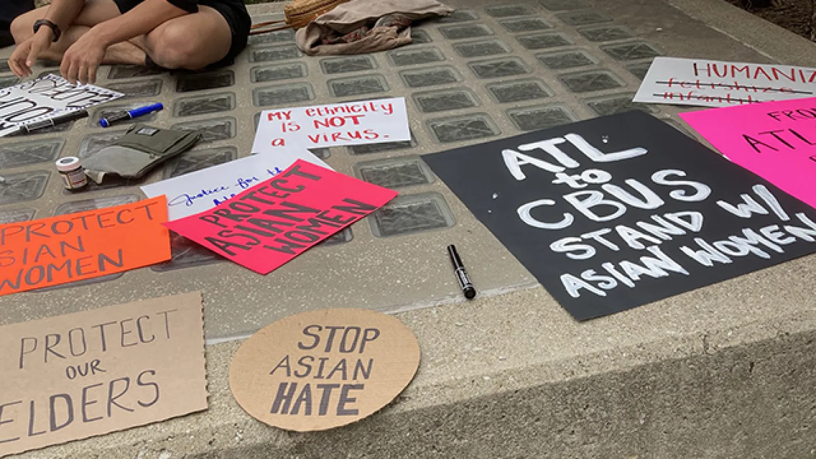 Homemade signs with messages advocating for Asians. Photo courtesy Pranav Jani.