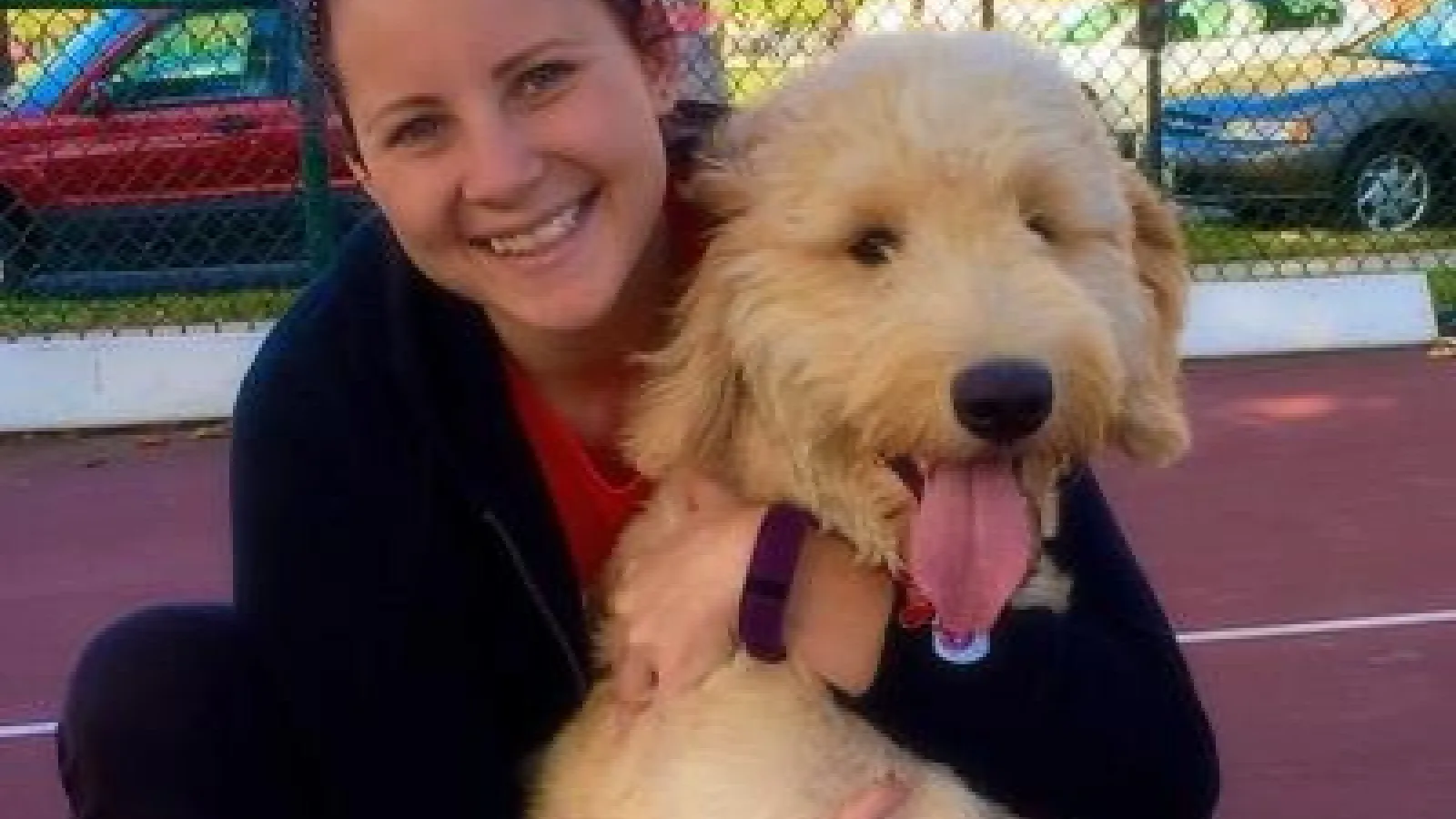 alumna with puppy