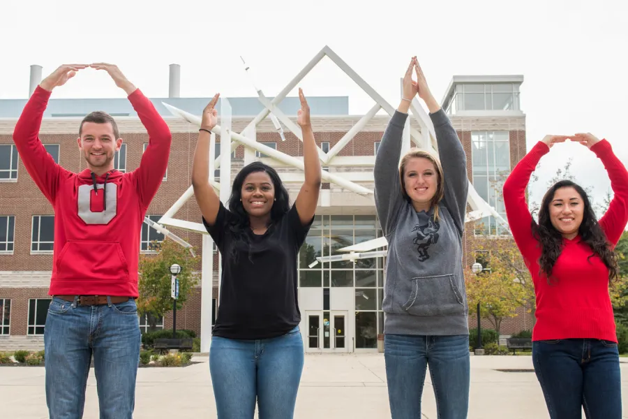 Students spelling out O-H-I-O with arms