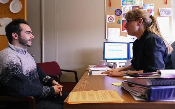 Advisor talking with student