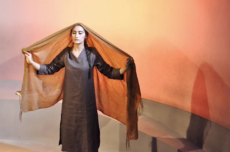 An actress performs in “Behind the Blast Wall” by Sonali Bhattacharyya, produced by Palindrome Productions, October 2017, London. Image by Manuela Chastelain.