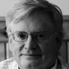 Tim May headshot in black and white