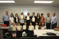 A group photo with students and faculty from Ohio State, the University of Osaka and employees from OTC Daihen